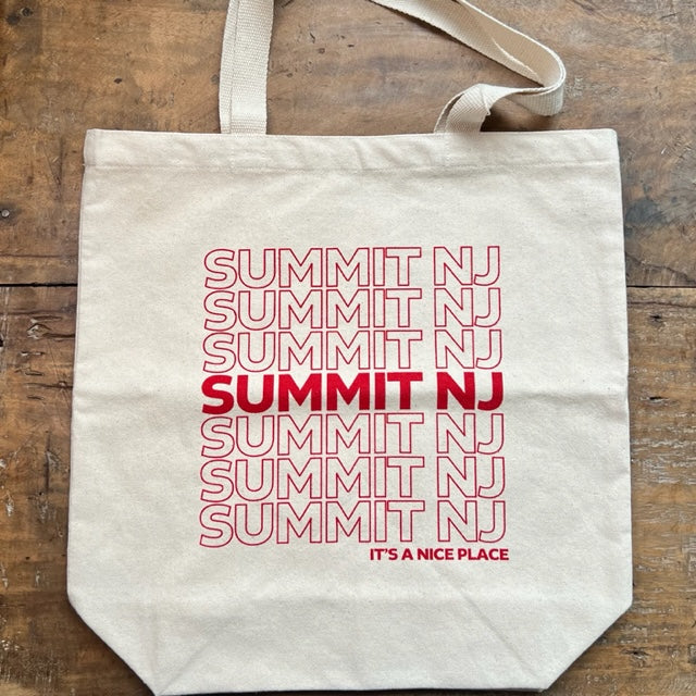 canvas tote bag that repeatedly has SUMMIT, NJ written across it in red letters. Under SUMMIT it reads It's a Nice Place.