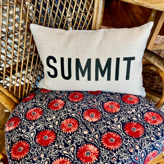 Small rectangular Summit pillow on a multicolored chair