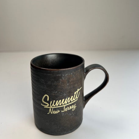 black espresso mug with cream logo