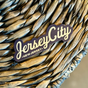 Jersey City sticker on a wicker table