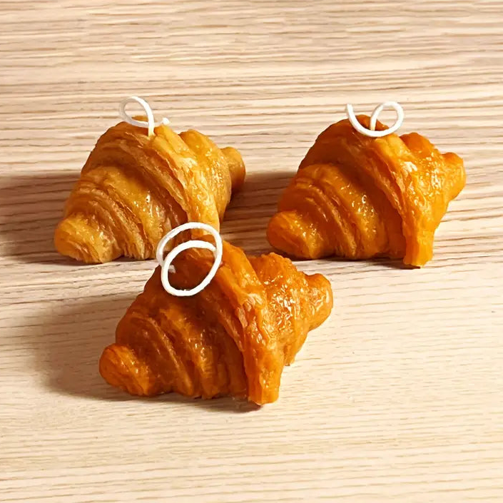 3 croissant shaped candles