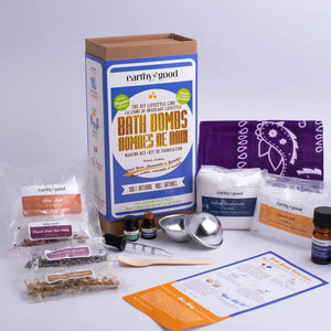 Box surrounded by contents of kit in plastic baggies, tools, small jars and purple bandana