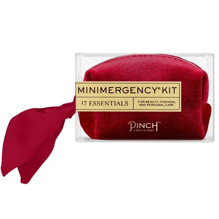 Deep red velvet pouch that reads "minimergency kit: 17 essentials for beauty, fashion & personal care" Pinch Provisions. 